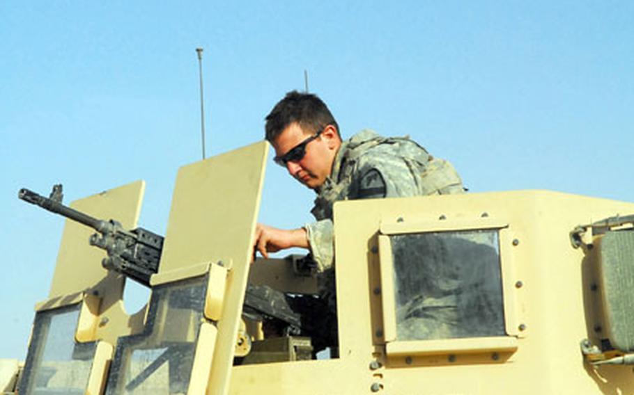 U.S. Army Spc. Michael Doke, 20, of Huffman, Texas, prepares to head out on a patrol in northern New Baghdad on Monday.