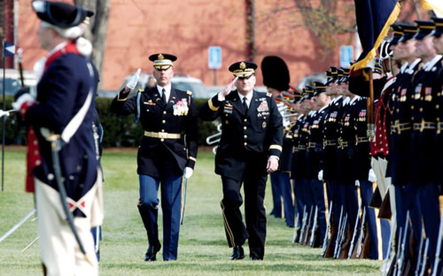 Gen. Peter Schoomaker, right, and Col. Robert Pricone inspecting the troop formation during the Army change of command ceremony Tuesday at Fort Meyer, Va. Gen. George W. Casey Jr. was named the 36th Chief of Staff at the Army during the event.