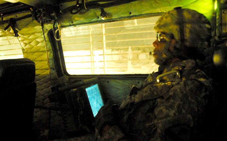 Sgt. 1st Class Augusta Creech, 37, of Wilson, N.C., commands a Buffalo mine clearing vehicle during a recent sweep in Baghdad.