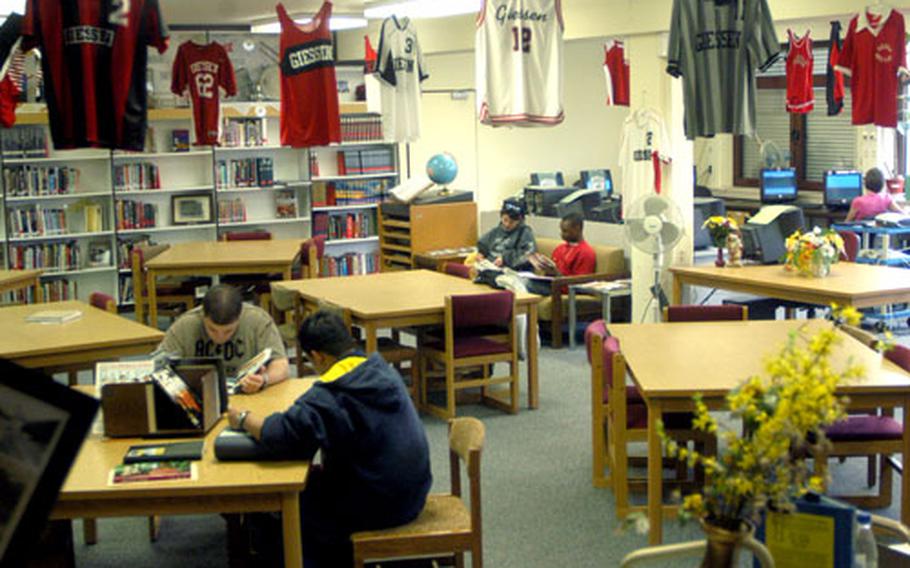 Giessen school librarian Jan Jensen has decorated the room with school memorabilia, including old sports jerseys worn by high school athletes. Meanwhile, students and faculty members are savoring the final few weeks as they prepare to move to new destinations.