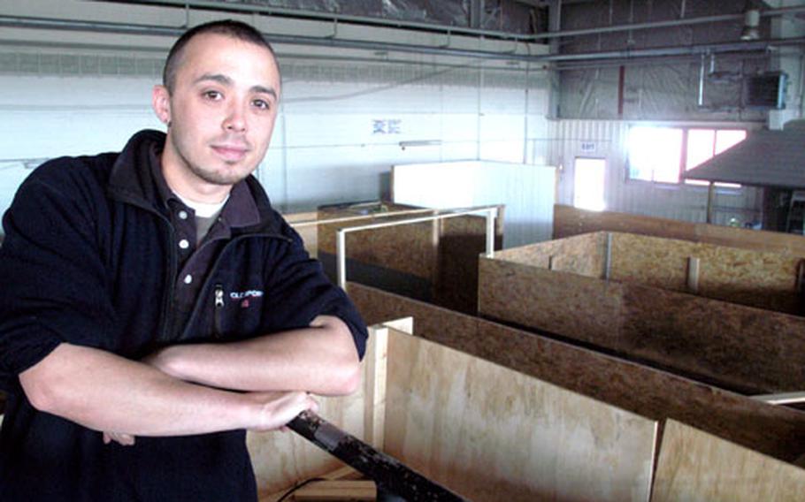 Robert M. Thompson II, Darmstadt Outdoor Recreation's lead recreation assistant and "paintball king," stands in the crow's nest overlooking the 8,000 square foot Red Baron Paintball Indoor Scenario Field.