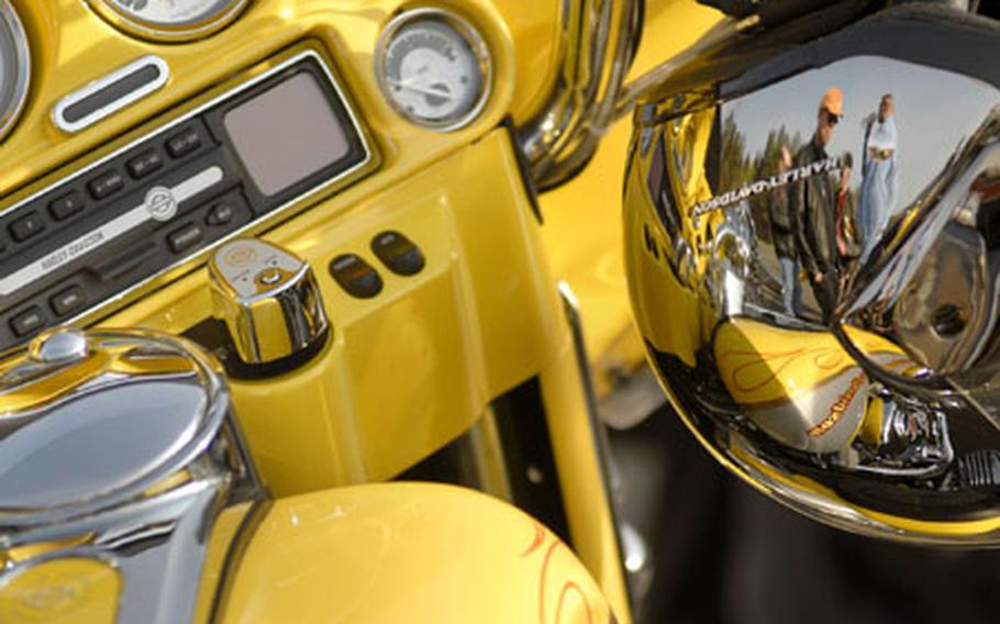Participants in the Kaiserslautern motorcycle safety day activities are scene on a chrome cycle helmet Friday at Kapaun Air Station. After a morning of training, a bike show and lunch, more than 100 motorcyclists ventured out on a 52-mile mentorship ride.