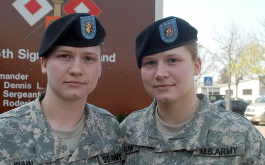 Julie, left, and Jennifer Kuhn, are identical twins and specialists with the 7th Signal Brigade in Mannheim, Germany. They were separated for the first time in their 21 years when they were assigned last year to different places in Iraq.