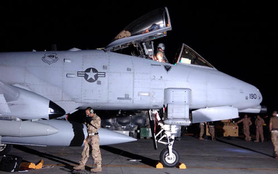 An air crew waits to greet the pilot of an A-10 following its arrival at Bagram Airfield in Afghanistan on Tuesday. The squadron of A-10s adds a second fighter squadron to the 455th Air Expeditionary Wing.