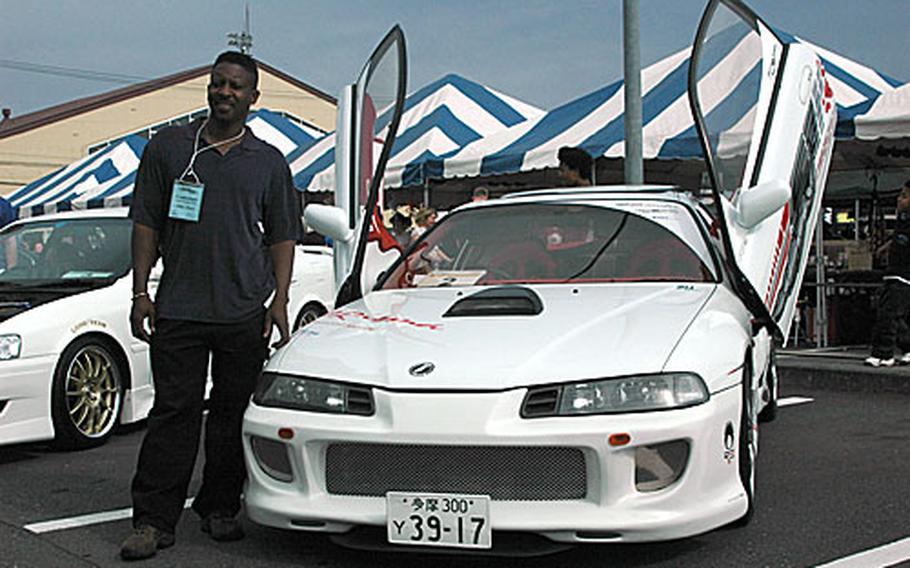 Master Sgt. Myron Potter and his scissor-doored 1992 Honda Prelude. Potted explained that he has spent nearly five years working on this, his first show car.