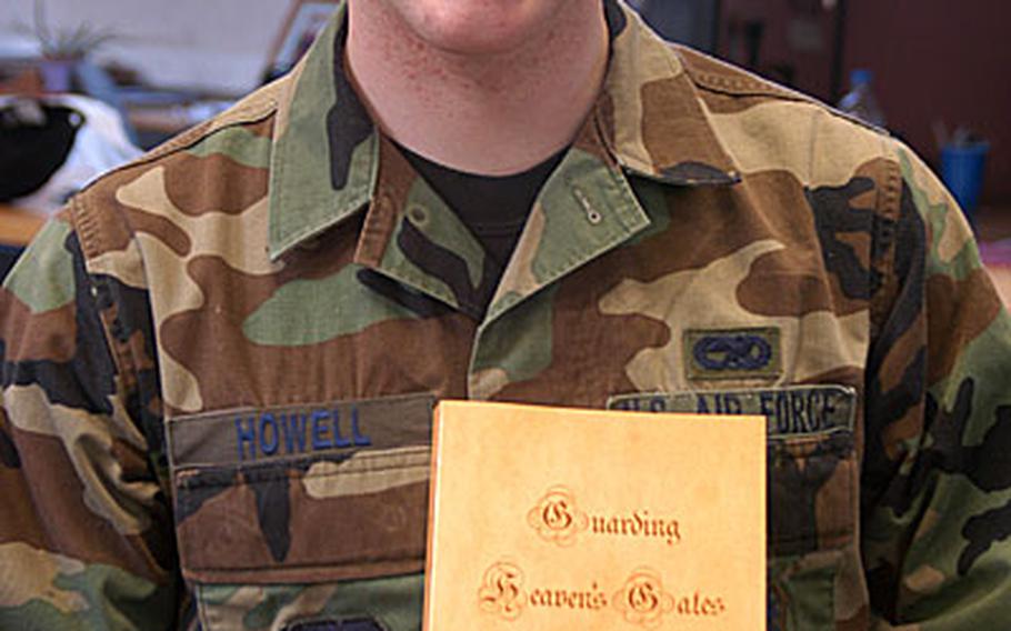 Airman 1st Class Joshua D. Howell and his new part-fantasy, part-reality book "Guarding Heaven's Gate."