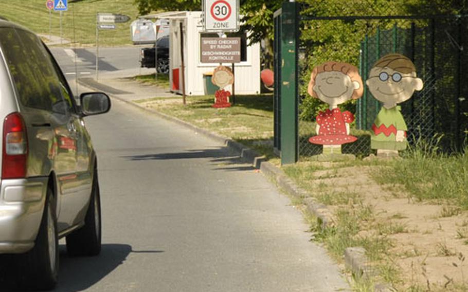 Traffic enters a U.S. housing area Wednesday in Wiesbaden, Germany. An American resident of Wiesbaden says there are three housing areas in the city without fences or identification checkpoints.