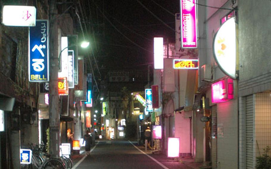 "Bar Row" in Fussa, Japan, is deserted at about 10:30 p.m. on a Friday night.