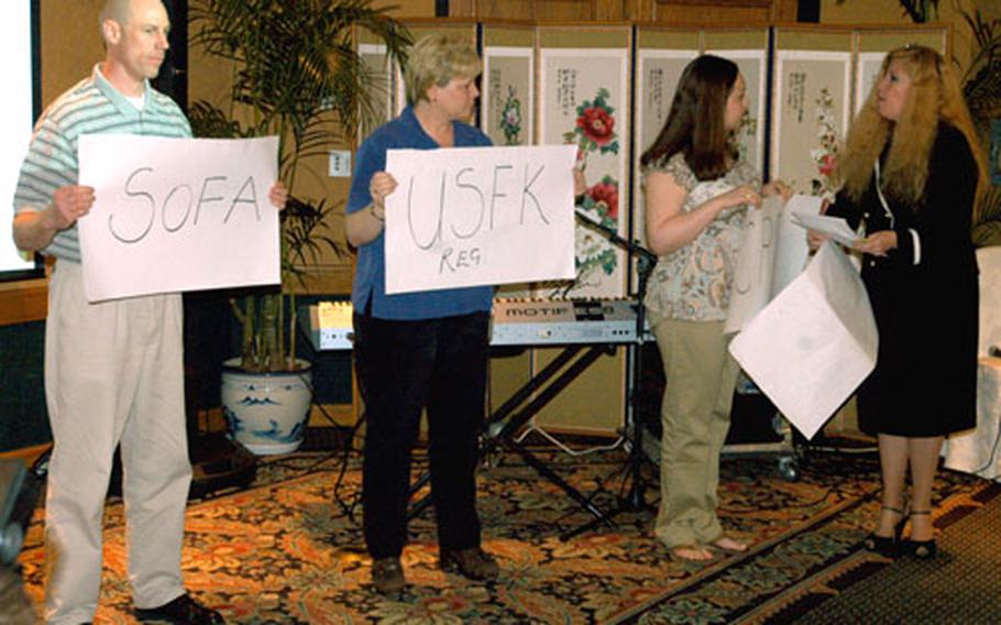 AFAP delegates perform a skit to illustrate the disparity between U.S. Forces Korea regulations and the status of forces agreement regarding the hiring of third-country spouses of U.S. citizens for non-appropriated funds positions.