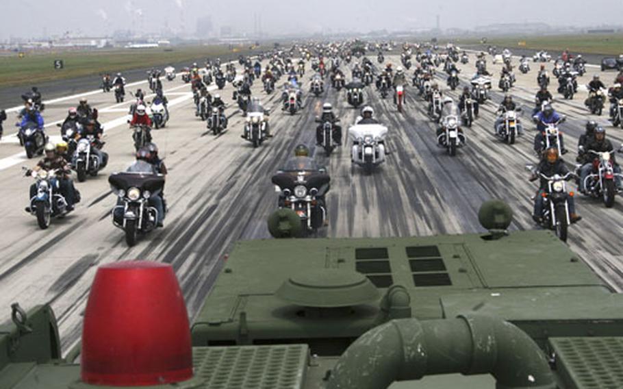 More than 430 motorcycles roar down the runway during "Rolling Thunder," one of the most popular ground events, during the 35th annual Friendship Day at Iwakuni Marine Corps Air Station, Japan. An estimated 270,000 visitors turned out Saturday for the base festival.