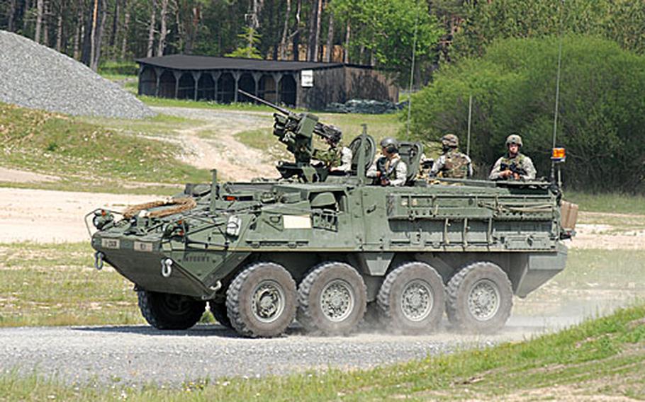 A 2nd Cavalry (Stryker) Regiment Stryker armored personnel carrier moves onto a range at Grafenwöhr Training area during a demonstration for delegates from the 56-member Organization for Security and Cooperation in Europe.