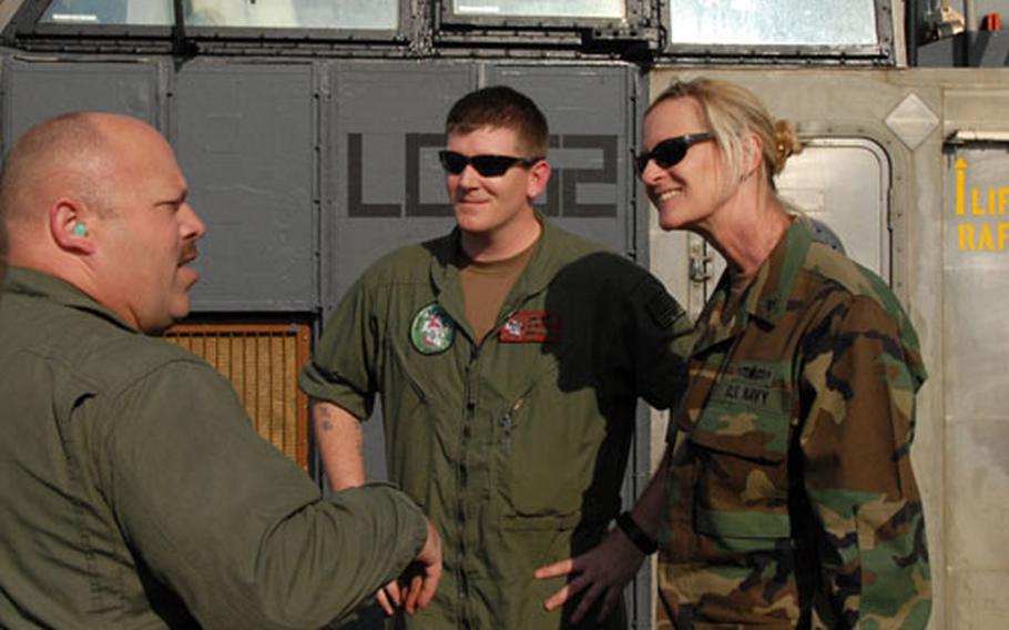 Rear Adm. Carol Pottenger talks with Marines on a Landing Craft Air Cushion earlier this year. As the commander of Amphibious Force, U.S. 7th Fleet, Pottenger is the first woman to take charge of a Navy strike group.