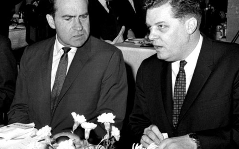 Former Vice President Richard M. Nixon talks with A. Lewis Burridge, president of the American Chamber of Commerce in Japan, in April, 1964.