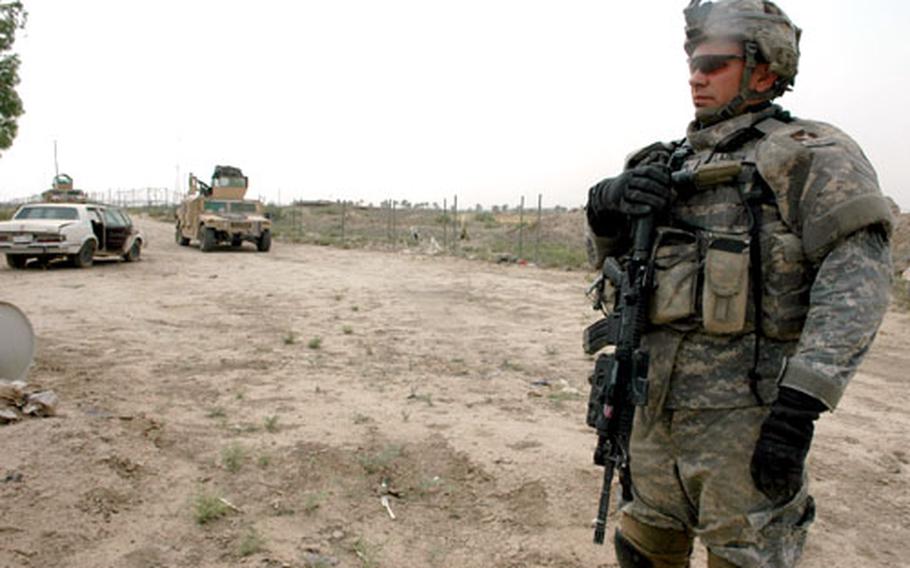 Staff Sgt. Matthew Larson, 34, of Burnsville, Minn., stands outside a farmhouse in Abu Ghraib, an area just outside of Baghdad’s city limits where the Outlaw Platoon with the Minnesota National Guard has done 425 patrols and counting. From training before Iraq to a 15-month stint based at Camp Liberty, the platoon is looking at 22 months away from home. “Most of us volunteered,” he said. “But if they ask us again, a year from now, most of us’ll say no.”