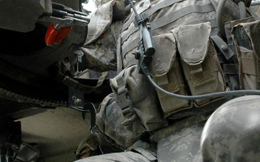Spc. Travis Caven, 26, of Mankato, Minn., sits in a Humvee turret while on patrol. The Minnesota National Guard has been deployed more than any other unit – active, guard or reserves – in the military. Caven, a member of the Outlaw Platoon, Company A, 2nd Battalion, 136th Minnesota National Guard, are nearing the end of a 22-month deployment.