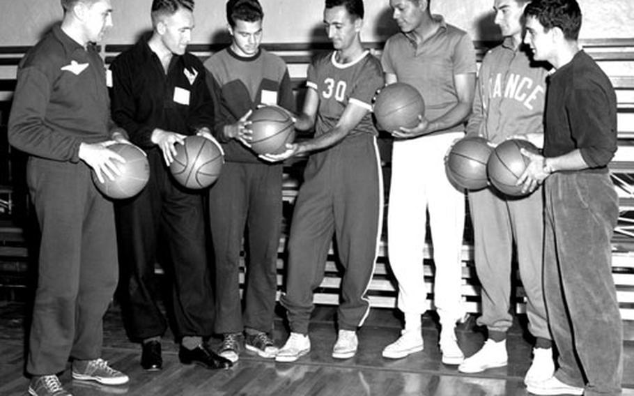 Bob Cousy poses with clinic participants from the U.S. and other NATO countries.