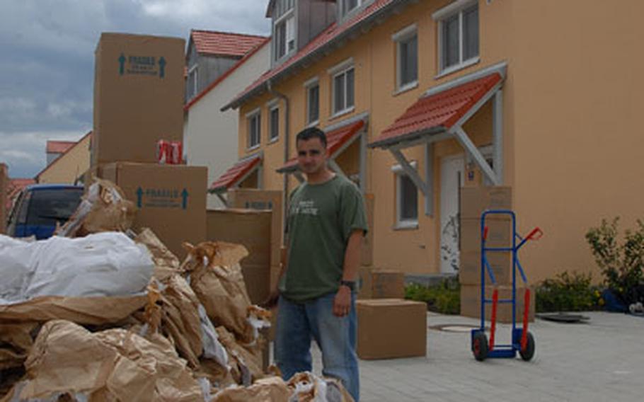 2nd Cavalry (Stryker) Regiment soldier Staff Sgt. Thomas Murphy stood amongst piles of brown cardboard boxes and discarded wrapping paper as movers helped his family settle in.