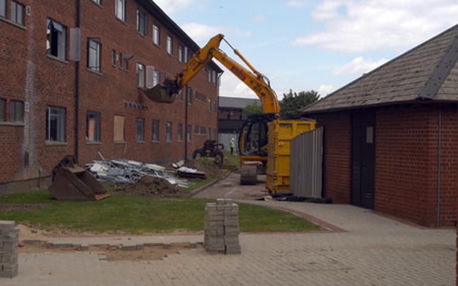 Demolition work began last week on Building No. 402 near the heart of RAF Mildenhall. The building is being razed as part of the base's long-term plan to construct new dormitories.