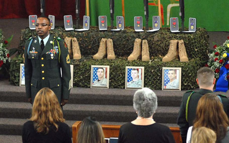 Sgt. 1st Class Anthony Barber does a last roll call for sergeants Alphonso Montenegro Jr. and Ryan Wood, and specialists Thomas Leemhuis, Daniel Agami and Anthony Hebert, all of 1st Battalion, 26th Infantry Regiment, 2nd Brigade Combat Team, 1st Infantry Division, at the memorial ceremony for the soldiers at Ledward Barracks, Schweinfurt, Germany, on Tuesday.