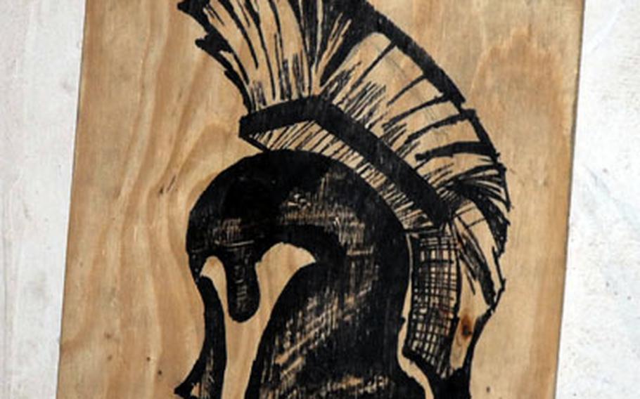 Spartan Platoon’s logo, painted by Pfc. Vinny Cantu, 19, adorns a wall where their second squad sleeps and where the platoon received heavy fire Sunday from enemies in the surrounding mountains. The Spartans, part of Battle Company, 2nd Battalion, 503rd Parachute Infantry Regiment, 173rd Airborne Brigade Combat Team, have been fighting in Afghanistan’s Korangal River Valley for almost two months.