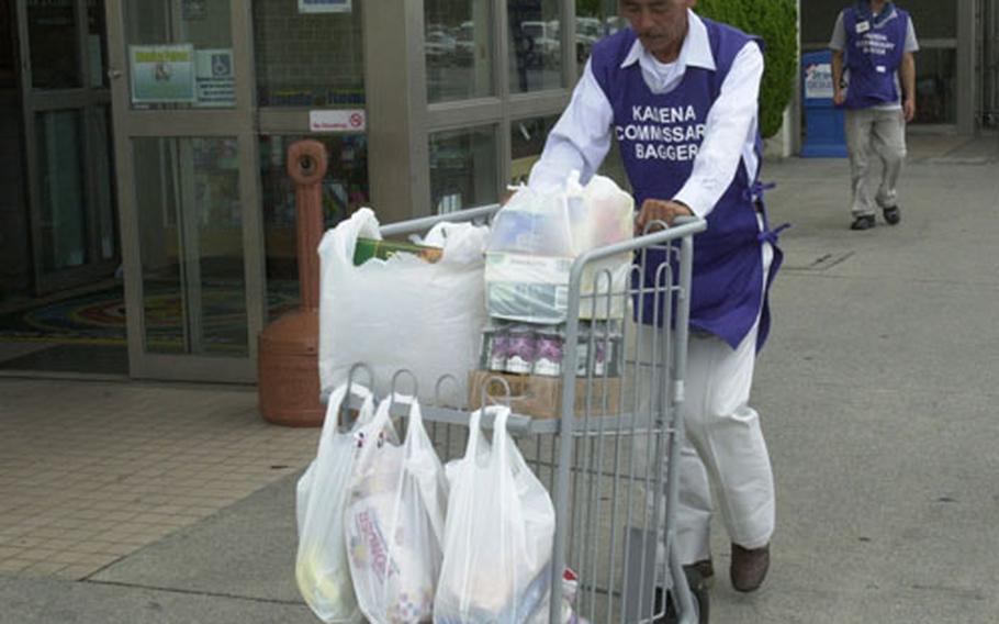 Patrons flocked to the Kadena Air Base commissary Thursday to stock up on items like water and snacks in preparation for Typhoon Man-Yi's arrival on Okinawa.