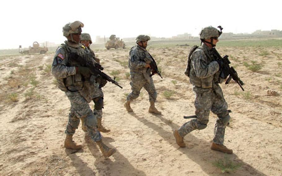 Members of the 5th Battalion, 82nd Field Artillery Regiment, begin a "meet and greet" program with residents near their newly established combat outpost in Iraq. From left to right are Sgt. 1st Class Wesley Denton, Staff Sgt. Baltazar Vela, and 1st Lt. Christopher Ricciardi.