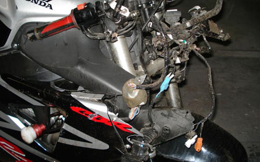 The front end of Staff Sgt. Kevin Louis Jones' Honda motorcycle following his wreck on the A11 highway.
