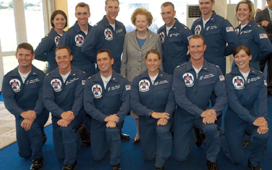 The U.S. Air Force Thunderbirds team poses for a photograph with former British Prime Minister Margaret Thatcher following the team's performance at the Royal International Air Tattoo on Saturday. Nearly 270 aircraft from 24 countries were slated to attend the annual air show at RAF Fairford.