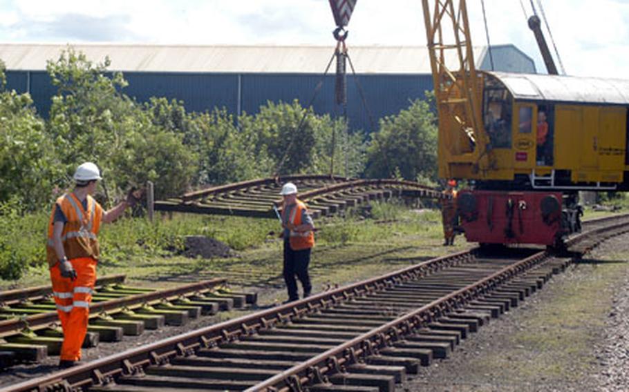 Volunteers lay down some railroad track as part of a Mid-Norfolk Railway Preservation Trust project in Dereham on a recent Saturday afternoon. The trust is currently looking for more volunteers to help with its ongoing project of maintaining and restoring a 17.5 mile stretch of railway, considered to be one of the largest preserved railways in the U.K.
