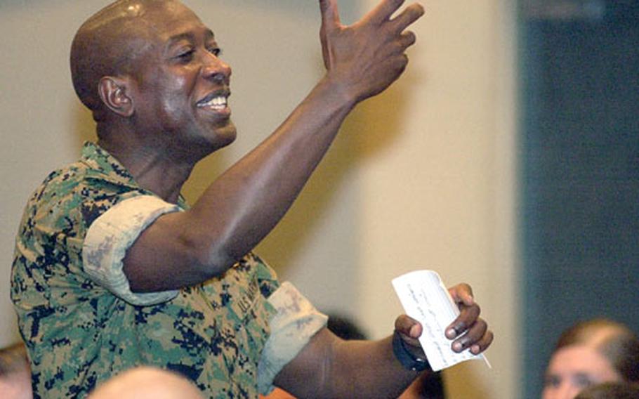 Sgt. Maj. of the Marine Corps Carlton W. Kent shares an anecdote during a brief with Marines at the Camp Kinser, Okinawa, auditorium on Tuesday.