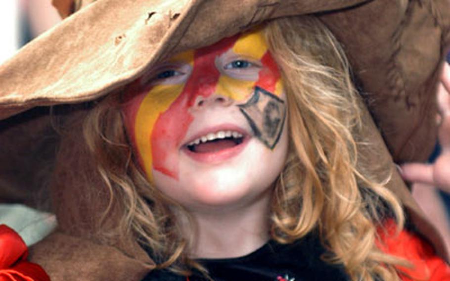 Five-year-old Lydia West of Darmstadt, Germany, gets into the spirit of the Friday night-Saturday morning release of the final book installment of Harry Potter. Her older brother, Collin, won a replica of the magical hat, moments earlier at a Harry Potter look-a-like contest at the Army and Air Force Exchange Service bookstore in Wiesbaden.