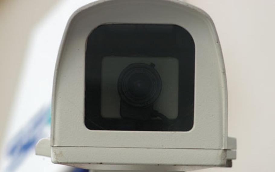 A closed-circuit television camera provides a watchful eye over streets in Cambridge, England.