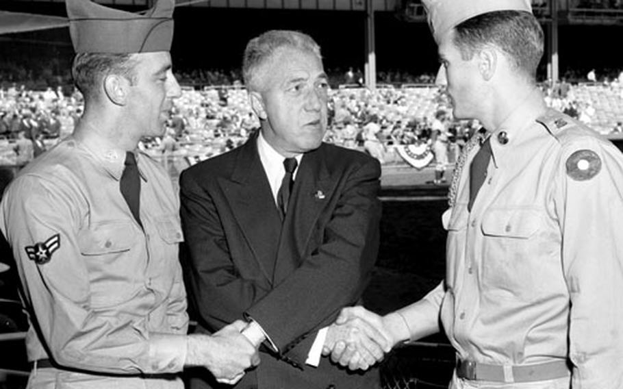 Ray Rosenbaum and George Morgan, the USAREUR and USAFE most valuable players, respectively, for the 1955 season, get the MVP treatment at Yankee Stadium before a World Series game.