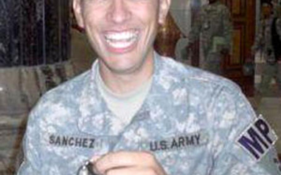 Spc. Alfonso Sanchez smiles as he holds up the keys to a new Jeep Patriot.