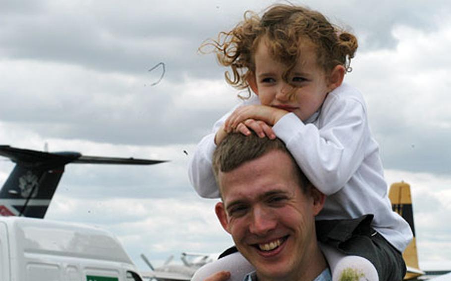 RAF Mildenhall 1st Lt. Matthias Daue, 26, of Berlin, Germany, and his 3-year-old daughter, Anastasia, were two of the dozens of visitors to the American Air Day at the Duxford Imperial War Museum last Saturday.