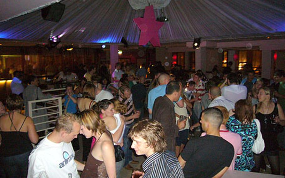 Partygoers get down on the dance floor inside the Ocean & Collins club in Oxford on a recent Friday night.
