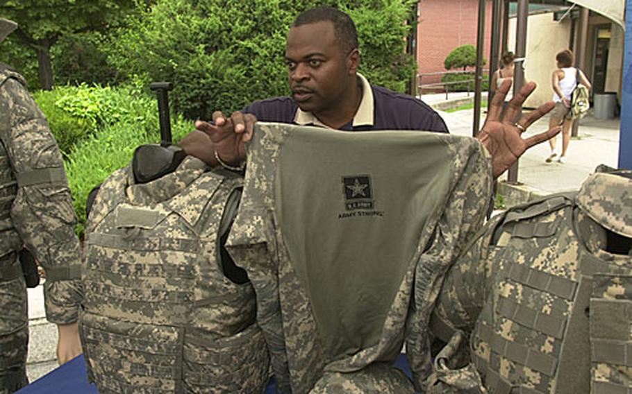 Francis Hayden shows the mesh shirt worn under the new generation of body armor.