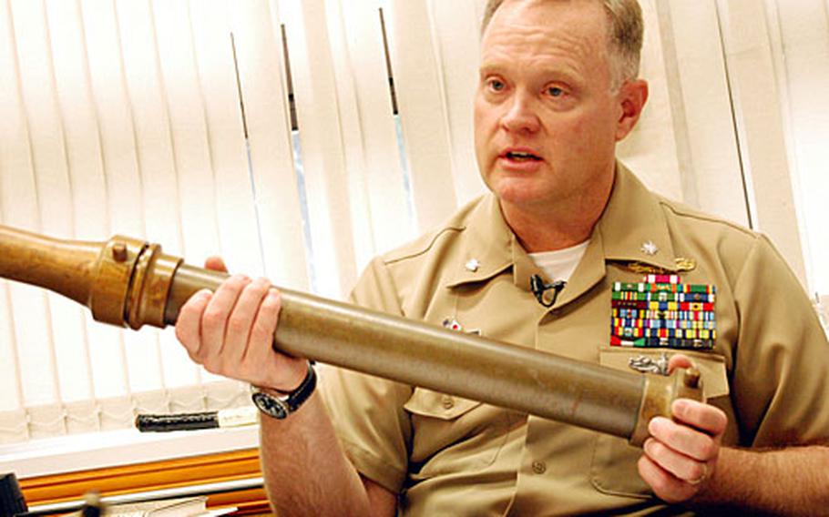 Yokosuka base chief staff officer Cmdr. Jon Lundquist is helping to organize a museum and is looking to find more historical artifacts like this fire hose.
