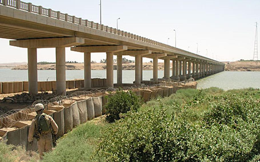In Rawah, on the Euphrates River in Iraq’s western Anbar province last week, U.S. Marines make one of their daily patrols of the vital bridge that spans the river through the city.