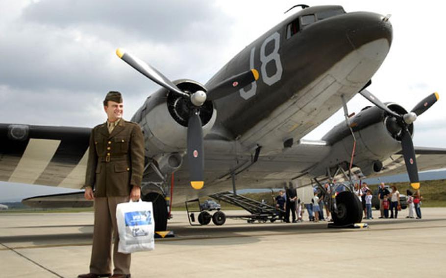 Tech. Sgt. Daniel Via, an airman assigned to the U. S. Air Forces in Europe directorate of personnel, enjoys being a captain for a day during the Air Force 60th anniversary celebration at Ramstein Air Base.