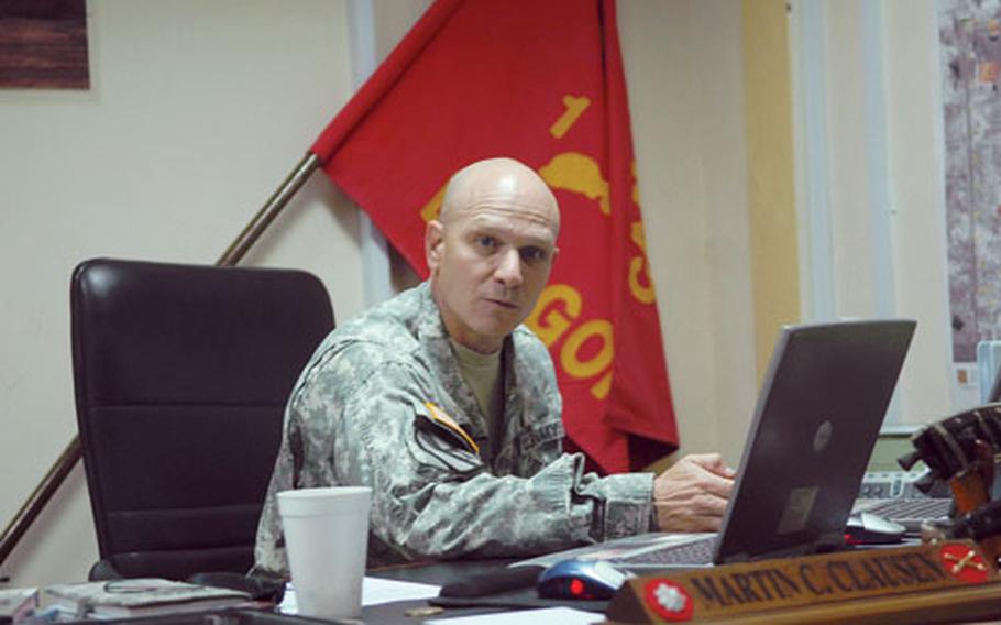 Lt. Col. Martin Clausen, commanding officer of the 1st Battalion, 82nd Field Artillery Regiment, works in his office on Camp Taji.