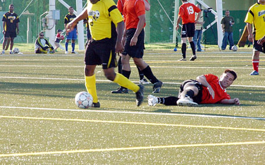 The first matchup on the new artificial turf at Yokosuka Naval Base’s Berkey Field was an intramural soccer game Monday between Afloat Training Group and Fleet Industrial Supply Center.
