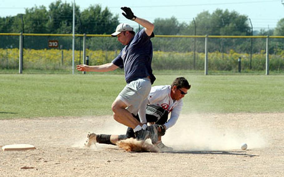 British team H20's right center fielder Stuart Butcher avoids a tag out by Pioneers shortstop Ben March in the championship game of the David Allen Memorial Co-Ed Classic softball tournament at RAF Lakenheath.