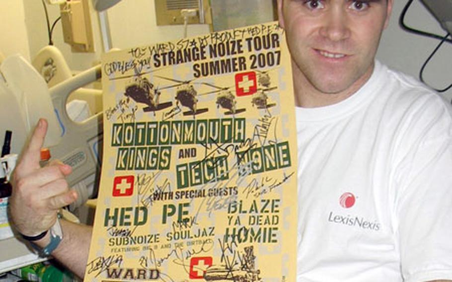 Members of several bands autographed this custom tour poster in Seattle for Army Guardsman Sgt. Marcus Kuboy, 29, that will hang on the wall in Walter Reed's Ward 57 soon. Kuboy, of Minneapolis, Minn., will get another copy for himself.