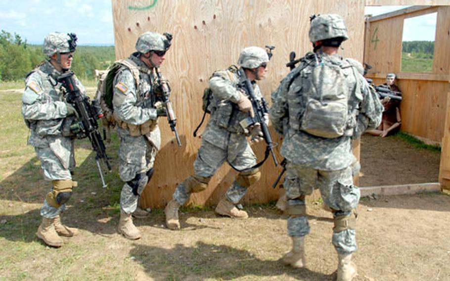 Soldiers from the 1st Battalion, 6th infantry Regiment clear a building during training at Grafenwöhr, Germany, on Tuesday.