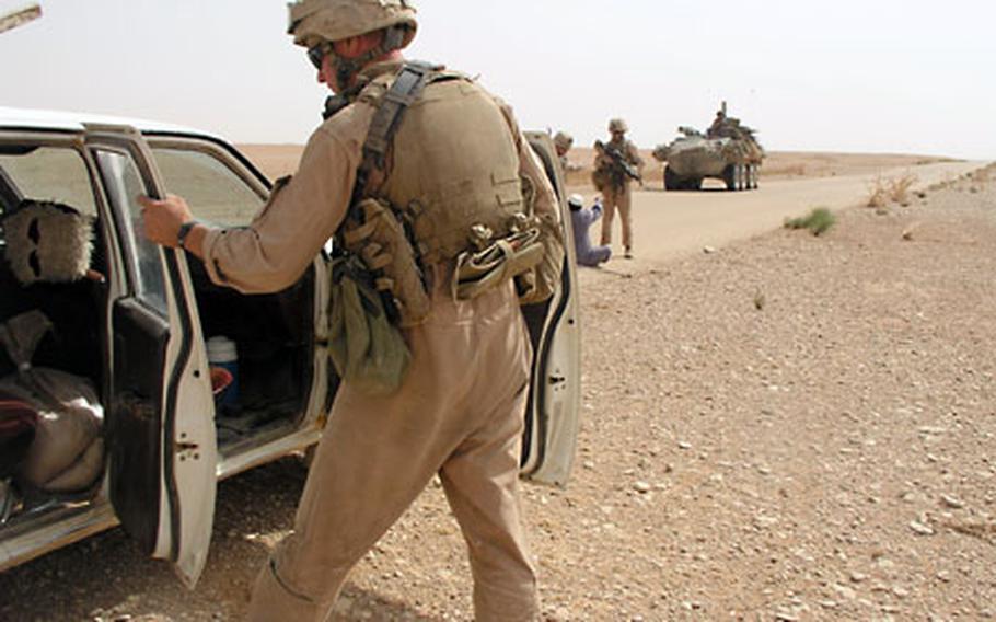 Thaddeus Herber, 19, of New Braunfels, Texas, searched a vehicle while fellow Marines waited with the vehicle’s occupant. Marines looking for insurgent activity may often ask Iraqis whether they’ve seen “Ali Baba,” widely understood to refer to insurgents or criminals.