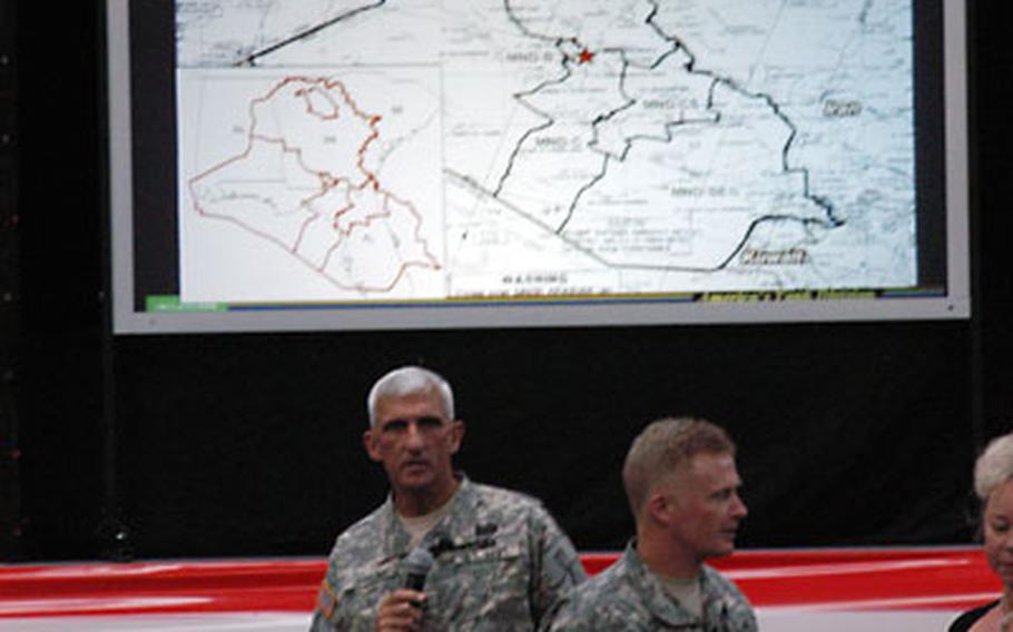At a large town hall meeting this week in Wiesbaden, Germany, 1st Armored Division commander Maj. Gen. Mark Hertling, left, summarized details of the divisional headquarters staff’s upcoming deployment to northern Iraq. Hertling highlighted support initiatives on the homefront, and said spouses and soldiers alike face “a tough 15 months.”