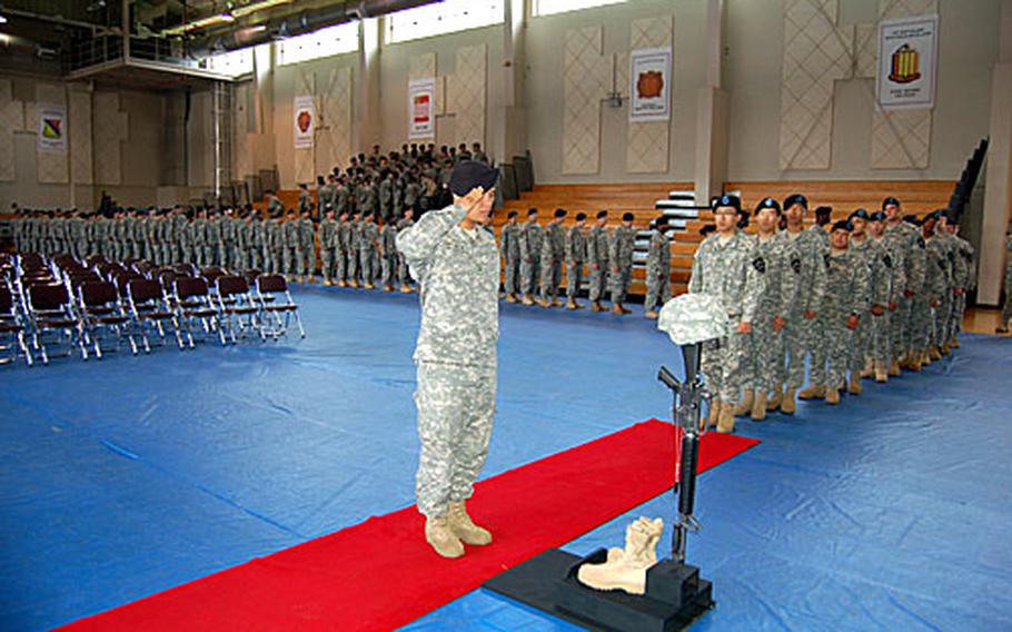 Soldiers from the 302nd Brigade Support Battalion line up to pay their last respects to Staff Sgt. Ricky Fox during a memorial ceremony Friday at Camp Casey&#39;s Carey Gym. Fox was found dead in his barracks room on Aug. 10. His death is under investigation.