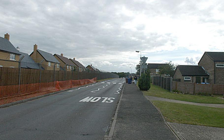 A view looking south along Radcliffe Road on RAF Lakenheath. New base boundaries mean that the units on the right, leased by the Air Force, will be off-base next year, while the new Liberty Village development houses on the left will be inside the new fence.