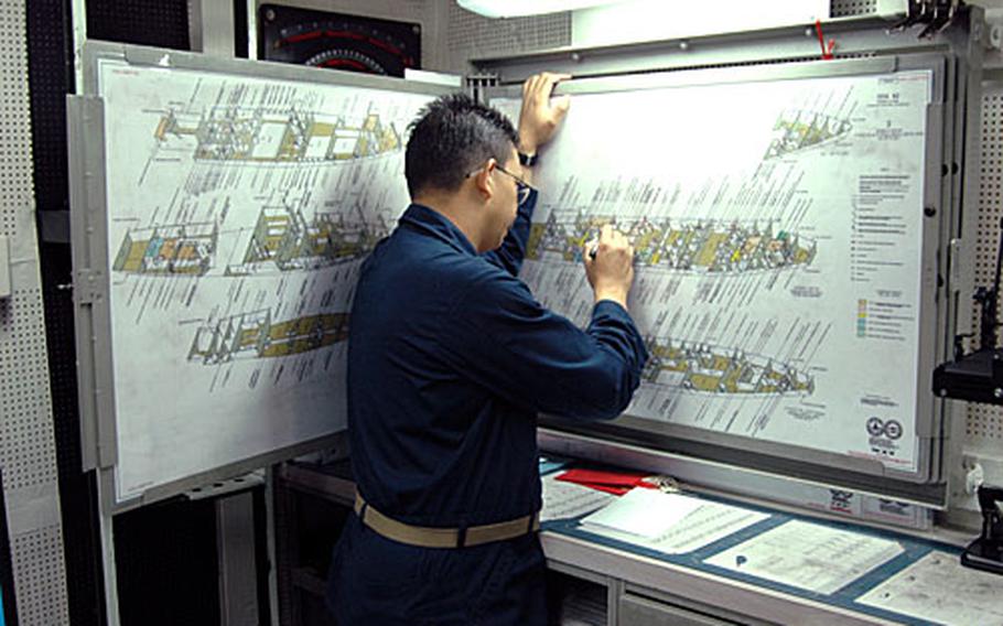 Until now, Navy ships have relied on schematics, like those pictured here, to track the status of spaces effected by floods, fires and other damage control issues. With a new computer system, however, laptops and software are joining firehoses and breathing apparatus to help save the ship.